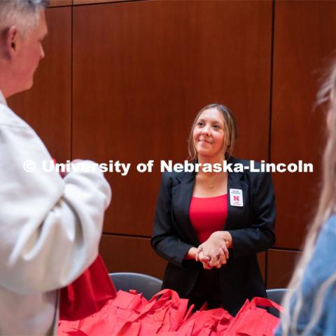 Allie Reynolds, center, greets incoming out-of-state students and family members during student admission’s National Tailgate at the Wick Alumni Center. Admitted Student Day is UNL’s in-person, on-campus event for all admitted students. March 24, 2023. Photo by Jordan Opp for University Communication.