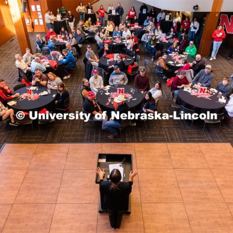 Allie Reynolds, center, speaks to out-of-state students and their families during student admission’s National Tailgate at the Wick Alumni Center. Admitted Student Day is UNL’s in-person, on-campus event for all admitted students. March 24, 2023. Photo by Jordan Opp for University Communication.