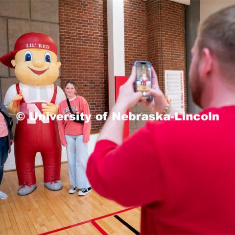 New students get their picture taken with Lil’ Red during Admitted Student Day inside University of Nebraska-Lincoln Campus Recreation Center. Admitted Student Day is UNL’s in-person, on-campus event for all admitted students. March 24, 2023. Photo by Jordan Opp for University Communication.