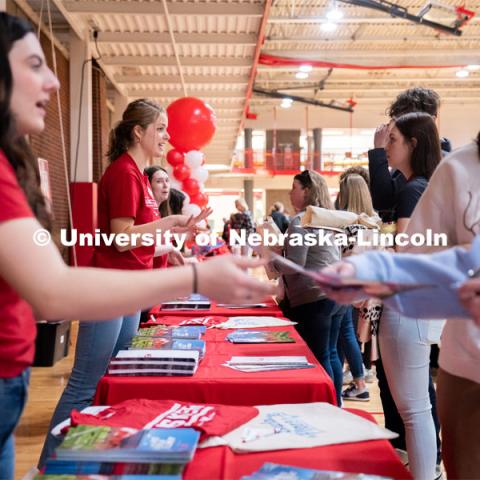 New students receive their name tags and information packets during Admitted Student Day. Admitted Student Day is UNL’s in-person, on-campus event for all admitted students. March 24, 2023. Photo by Jordan Opp for University Communication.