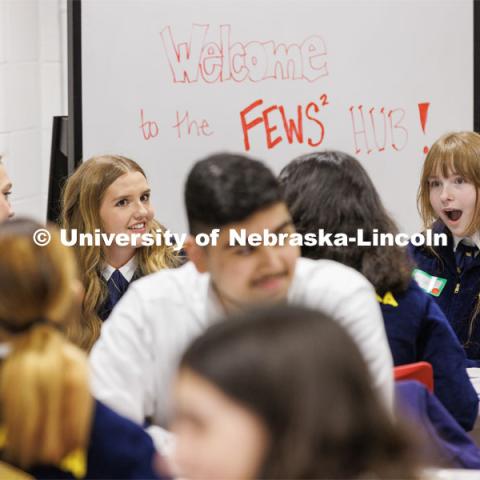 Carolina Thompson, right, from Omaha Bryant FFA reacts as she and Megan Kindschuh from Axtell FFA exchange stories with their pen pals. FFA pen pals from urban and rural schools meet face-to-face during the FFA state convention. March 29, 2023. Photo by Craig Chandler / University Communication.