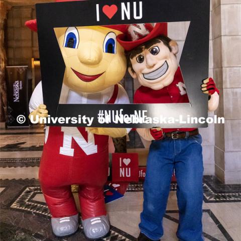 Lil Red and Herbie Husker pose for a photo at the I Love NU day at the State Capitol. April 5, 2023. Photo by Craig Chandler / University Communication.