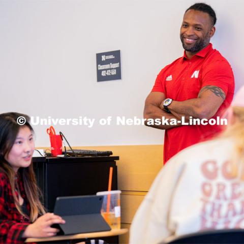 Ahman Green listens as students plan an esports event during his Intro to Esports class in Andersen Hall. April 19, 2023. Photo by Jordan Opp for University Communication.