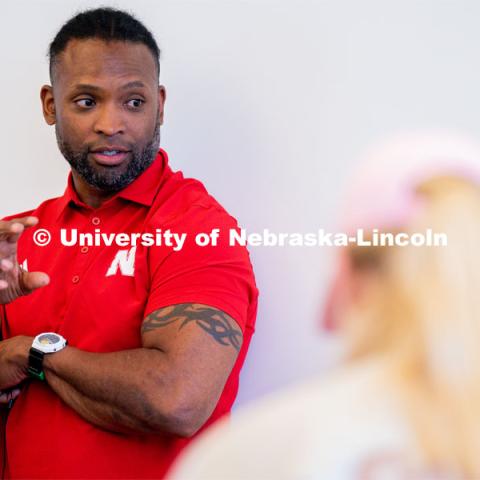 Ahman Green talks to students as they plan an esports event during his Intro to Esports class in Andersen Hall. April 19, 2023. Photo by Jordan Opp for University Communication.