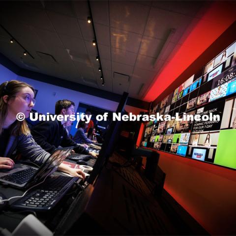 Students watch the monitors in the control room, and they produce their Nebraska Nightly telecast in the new Don and Lorena Meier Studio. April 28, 2023. Photo by Craig Chandler / University Communication.