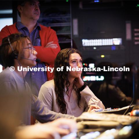 Jillian Lamkins watches the control room monitors during the newscast. Students produce their Nebraska Nightly telecast in the new Don and Lorena Meier Studio. April 28, 2023. Photo by Craig Chandler / University Communication.