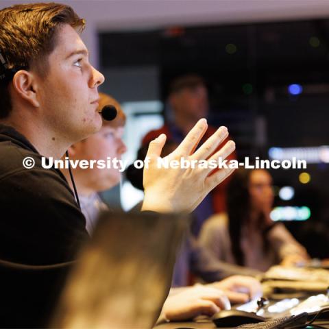 Logan Eby watches the control room monitors during the newscast. Students produce their Nebraska Nightly telecast in the new Don and Lorena Meier Studio. April 28, 2023. Photo by Craig Chandler / University Communication.