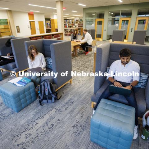 Students study in a private chair in the Law Library. College of Law photo shoot. April 28, 2023. Photo by Craig Chandler / University Communication.