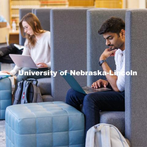 Students study in a private chair in the Law Library. College of Law photo shoot. April 28, 2023. Photo by Craig Chandler / University Communication.