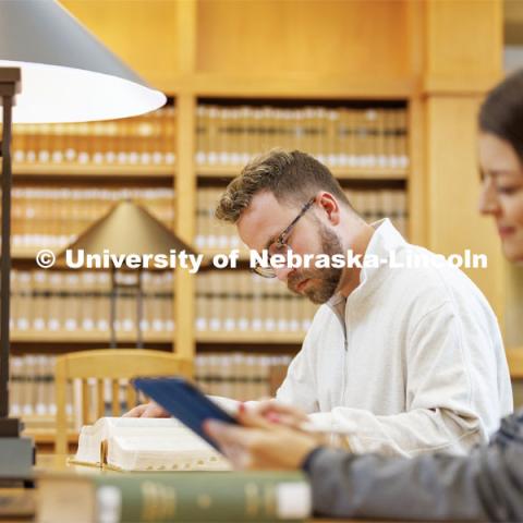 Students studying in the Law Library. College of Law photo shoot. April 28, 2023. Photo by Craig Chandler / University Communication.