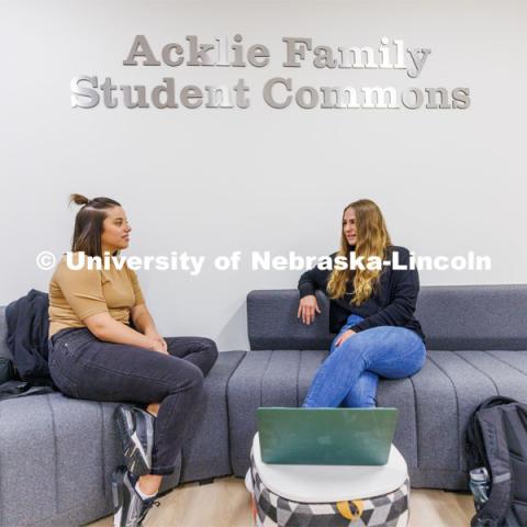 Students hang out in the Acklie Family Student Commons before class. College of Law photo shoot. April 28, 2023. Photo by Craig Chandler / University Communication.