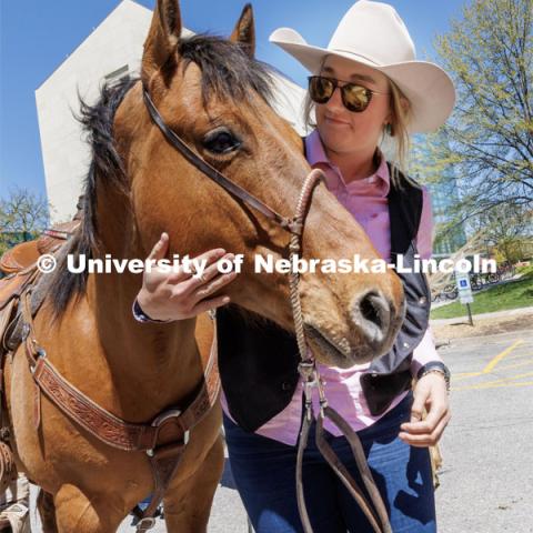 Jadyn Fleischman talks with her horse outside Hawks Hall after unloading it from the horse trailer. Students in Rob Simon’s capstone marketing course held a promotional event for the UNL rodeo on the west side of the Union on Monday. The class developed a marketing strategy for the Rodeo Club to help promote their upcoming rodeo. Seven horses and multiple club members were on city campus for students to meet, get close to and have their photos taken. May 1, 2023. Photo by Craig Chandler / University Communication.