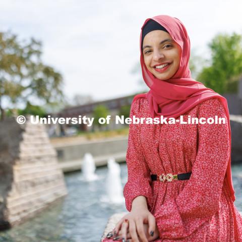 Sukaina Al-Hamedi, Husker Dialogue speaker is photographed outside the Nebraska Union by the Broyhill Fountain. May 10, 2023. Photo by Craig Chandler / University Communication.