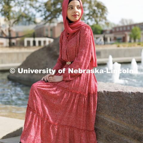 Sukaina Al-Hamedi, Husker Dialogue speaker is photographed outside the Nebraska Union by the Broyhill Fountain. May 10, 2023. Photo by Craig Chandler / University Communication.