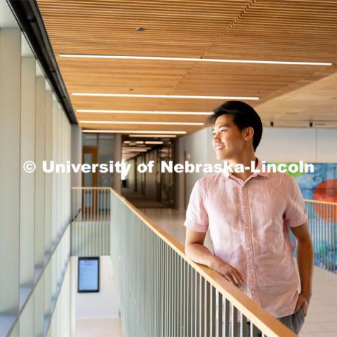 Andre Nguyen, Junior in Nutritional Science and Dietetics, smiles for a photo inside the Gwendolyn A. Newkirk Human Sciences Building. APIDA Heritage Month Feature. He is also a member of DMNV Lion Dance. May 16, 2023. Photo by Jonah Tran/ University Communication