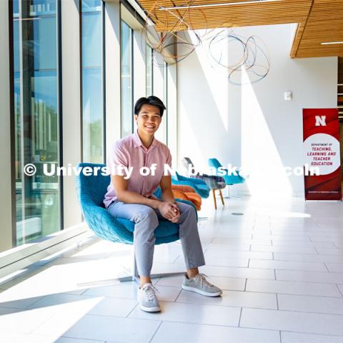 Andre Nguyen, Junior in Nutritional Science and Dietetics, smiles for a photo inside the Gwendolyn A. Newkirk Human Sciences Building. APIDA Heritage Month Feature. He is also a member of DMNV Lion Dance. May 16, 2023. Photo by Jonah Tran/ University Communication