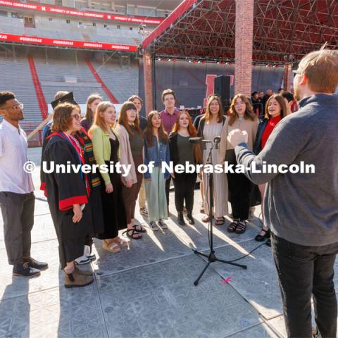 UNL Jazz Singers perform the National Anthem. Undergraduate commencement at Memorial Stadium. May 20, 2023. Photo by Craig Chandler / University Communication.