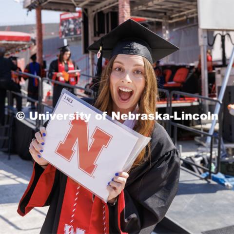 Morgan Twiss smiles for the camera. Undergraduate commencement at Memorial Stadium. May 20, 2023. Photo by Craig Chandler / University Communication.