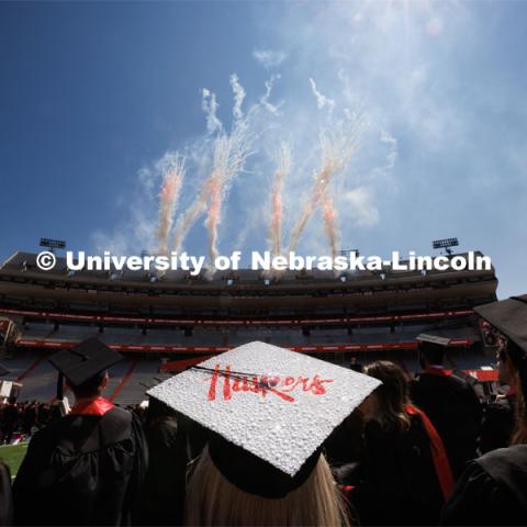 Ashtyn Tridle watches the fireworks at the conclusion of commencement. Undergraduate commencement at Memorial Stadium. May 20, 2023. Photo by Craig Chandler / University Communication.