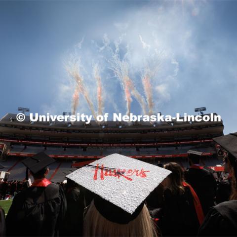 THIS PHOTO FOR MARKETING PURPOSES ONLY.  In original photo, fireworks company reversed the N as viewed from inside the stadium. Ashtyn Tridle watches the fireworks at the conclusion of commencement. Undergraduate commencment at Memorial Stadium. May 20, 2023. Photo by Craig Chandler / University Communication. 