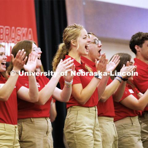 Maddie Hansen cheers as the orientation leaders are introduced. New Student Enrollment. May 30, 2023. Photo by Craig Chandler / University Communication.