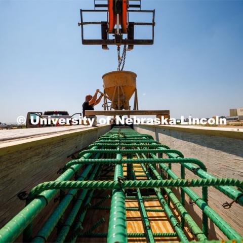 Concrete is poured into a barrier being tested at the Midwest Roadside Safety Facility for the State of Hawaii. Photo used for 2022-2023 Annual Report on Research at Nebraska. June 5, 2023. Photo by Craig Chandler / University Communication.
