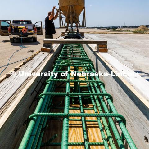 Concrete is poured into a barrier being tested at the Midwest Roadside Safety Facility for the State of Hawaii. Photo used for 2022-2023 Annual Report on Research at Nebraska. June 5, 2023. Photo by Craig Chandler / University Communication.
