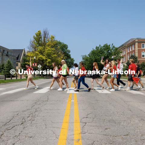 Orientation Leader Maddie Ames leads her NSE group toward Andersen Hall as they tour the journalism college. New Student Enrollment ( NSE ) on City Campus. June 13, 2023. Photo by Craig Chandler / University Communication.