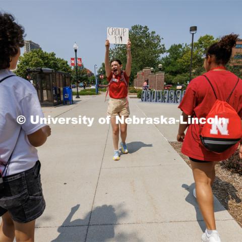 Orientation Leader Maddie Ames leads her NSE group toward Love Library. New Student Enrollment ( NSE ) on City Campus. June 13, 2023. Photo by Craig Chandler / University Communication.