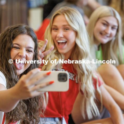 Mia Bowling of Omaha takes a selfie with her friends at New Student Enrollment. New Student Enrollment ( NSE ) on City Campus. June 13, 2023. Photo by Craig Chandler / University Communication.