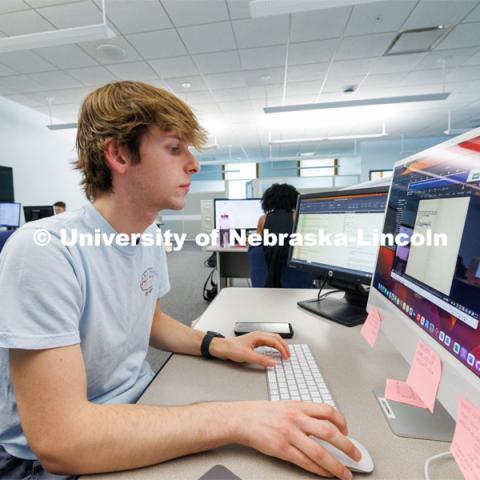 Luke McDermott a sophomore from Omaha and a UCARE student, works on researching a case. Students in Research Experiences for Undergraduates summer program are working to study how various marginalized groups in American history used the law to contest and advance their rights. June 14, 2023. Photo by Craig Chandler / University Communication.