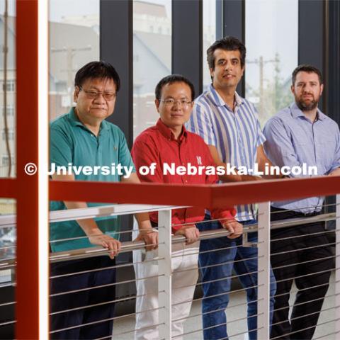 Nebraska Engineering researchers (from left) Yongfeng Lu, Bai Cui, Piyush Grover, and Keegan Moore are on teams that received three-year, $600,000 grants from the Defense Established Program to Stimulate Competitive Research (DEPSCoR). The group are posed in the Engineering Research Center. June 27, 2023. Photo by Craig Chandler / University Communication.