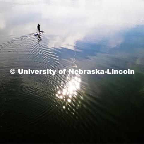 Richard Moberly, dean of the college of law, paddleboards at Pawnee State Recreation area northwest of Lincoln. Downtime with the Deans series for Alumni Magazine. July 19, 2023. Photo by Craig Chandler / University Communication.