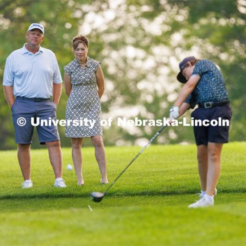 College of Agricultural Sciences and Natural Resources Dean, Tiffany Heng-Moss and her husband, Mike, watch their son, Max, practice golf. They enjoy watching their two children play golf in their spare time. Downtime with the Deans series for Alumni Magazine. July 21, 2023. Photo by Craig Chandler / University Communication.