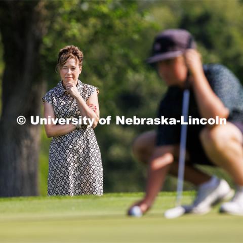 College of Agricultural Sciences and Natural Resources Dean, Tiffany Heng-Moss watches her son, Max, practice golf. She enjoys watching their two children play golf in her spare time. Downtime with the Deans series for Alumni Magazine. July 21, 2023. Photo by Craig Chandler / University Communication.