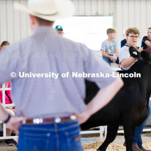 Braeden Humphreys of Wymore keeps his eye on the judge during the senior division beef showmanship competition. 4H/FFA Beef Show at the Gage County Fair and Expo in Beatrice. July 28, 2023. Photo by Craig Chandler / University Communication.