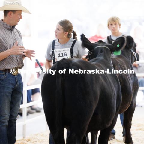 Avery Barnard of Beatrice listens to showmanship tips from the judge during the senior division beef showmanship competition. 4H/FFA Beef Show at the Gage County Fair and Expo in Beatrice. July 28, 2023. Photo by Craig Chandler / University Communication.