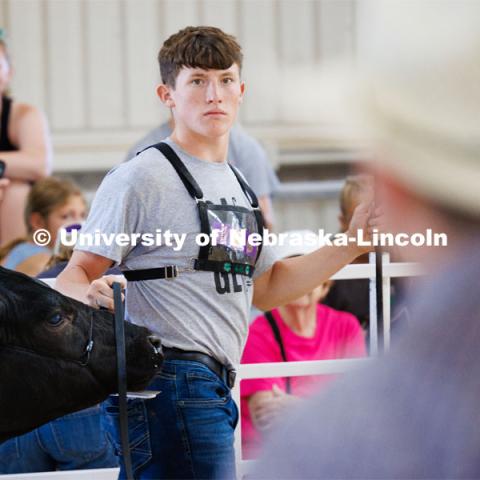 Shelton Crawford of Beatrice eyes the judge during the senior division beef showmanship competition. 4H/FFA Beef Show at the Gage County Fair and Expo in Beatrice. July 28, 2023. Photo by Craig Chandler / University Communication.