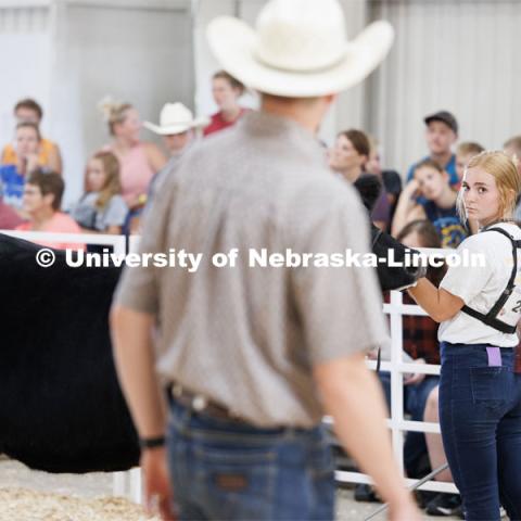 Avery Kraus of Burr eyes the judge during the senior division beef showmanship competition. 4H/FFA Beef Show at the Gage County Fair and Expo in Beatrice. July 28, 2023. Photo by Craig Chandler / University Communication.