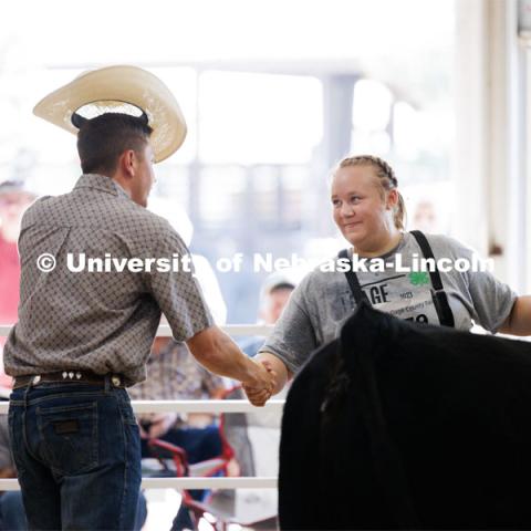 Natalie Trauernicht of Wymore accepts congratulations from the judge after winning the grand champion senior division beef showmanship competition. 4H/FFA Beef Show at the Gage County Fair and Expo in Beatrice. July 28, 2023. Photo by Craig Chandler / University Communication.
