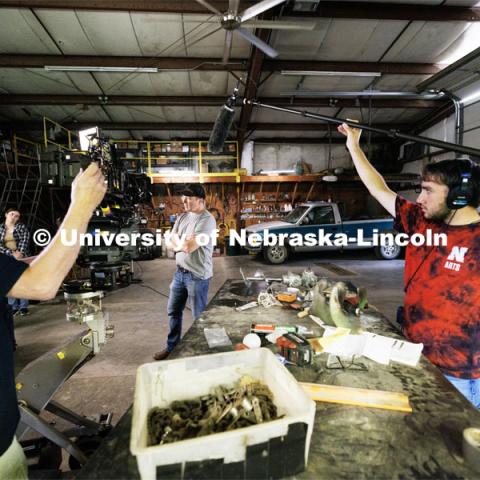 Lincoln actor Eric Moyer acts his lines as he is filmed by director of photography Barry Joyce and UNL student Isaiah Griffith holds a boom mic. Filming of the movie using UNL students as the production crew. Richard Endacott earned multiple awards for his screenplay, "Turn Over." Story about keeping the family farm operating in the modern era as two brothers come together via restoring an old tractor to help fund their operations. August 9, 2023. Photo by Craig Chandler / University Communication.