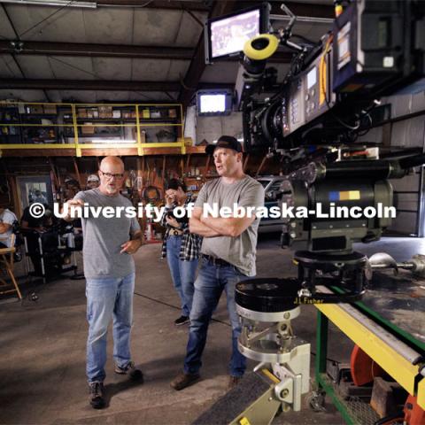 Richard Endacott describes what he wants in a scene to Lincoln actor Eric Moyer. Filming of the movie using UNL students as the production crew. Richard Endacott earned multiple awards for his screenplay, "Turn Over." Story about keeping the family farm operating in the modern era as two brothers come together via restoring an old tractor to help fund their operations. August 9, 2023. Photo by Craig Chandler / University Communication.