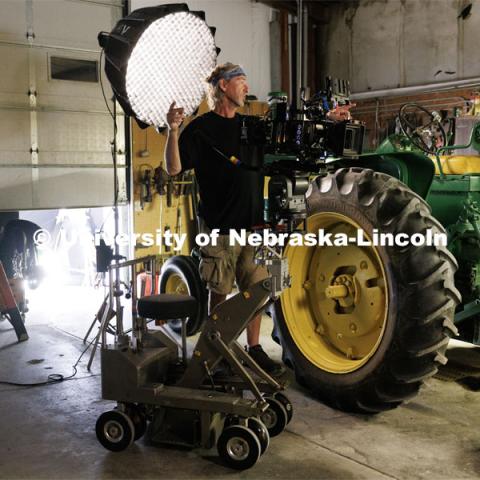 Director of Photography Barry Joyce asks for a light to be adjusted. Filming of the movie using UNL students as the production crew. Richard Endacott earned multiple awards for his screenplay, "Turn Over." Story about keeping the family farm operating in the modern era as two brothers come together via restoring an old tractor to help fund their operations. August 9, 2023. Photo by Craig Chandler / University Communication.