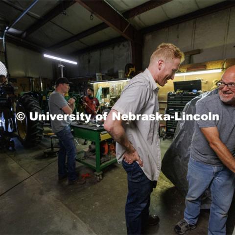 Richard Endacott, right, discusses a scene with Chicago actor Calvin Chervinko. Filming of the movie using UNL students as the production crew. Richard Endacott earned multiple awards for his screenplay, "Turn Over." Story about keeping the family farm operating in the modern era as two brothers come together via restoring an old tractor to help fund their operations. August 9, 2023. Photo by Craig Chandler / University Communication.