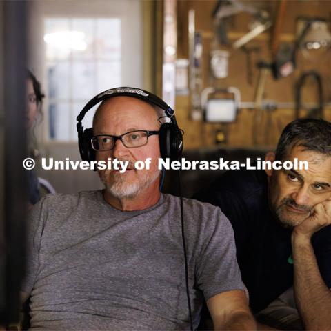 UNL professors Richard Endacott and Steve Kolbe watch the filming on a remote monitor. Filming of the movie using UNL students as the production crew. Richard Endacott earned multiple awards for his screenplay, "Turn Over." Story about keeping the family farm operating in the modern era as two brothers come together via restoring an old tractor to help fund their operations. August 9, 2023. Photo by Craig Chandler / University Communication.