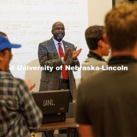 Chancellor Rodney Bennett applauds the band. Cornhusker Marching Band practice. August 17, 2023. Photo by Craig Chandler/ University Communication.