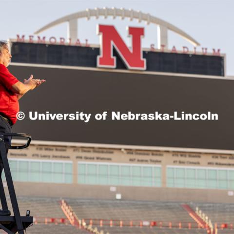 Director of the Cornhusker Marching Band, Anthony Falcone, stands high on the ladder overlooking the band. Big Red Welcome week featured the Cornhusker Marching Band Exhibition in Memorial Stadium where they showed highlights of what the band has been working on during their pre-season Band Camp, including their famous “drill down”. August 18, 2023. Photo by Sammy Smith / University Communication.