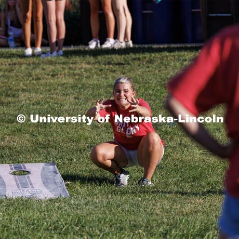 Maddy Tubrick of Omaha can’t believe her toss went so badly as she and Brooklyn Hardie of Sioux City, Iowa compete in corn hole. Chancellor’s BBQ in the green space between the Nebraska Union and Kauffmann Academic Residence Center. August 18, 2023. Photo by Matthew Strasburger / University Communication.