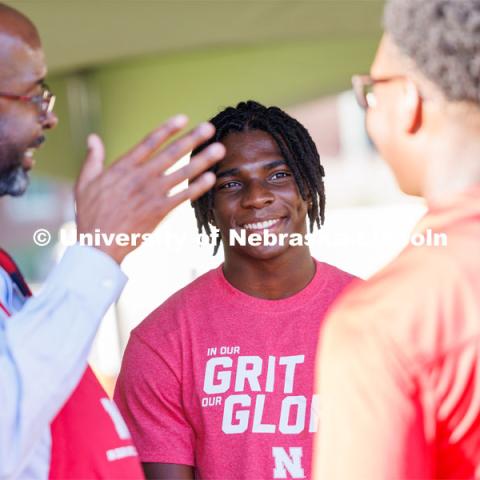 Chancellor Rodney Bennet talks with students at the Chancellor’s BBQ in the green space between the Nebraska Union and Kauffmann Academic Residence Center. August 18, 2023. Photo by Matthew Strasburger / University Communication.