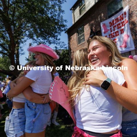 Hugs outside Delta Gamma sorority. Sorority Bid Day in the Cather Dining Complex and on the Vine Street Fields. August 19, 2023. Photo by Craig Chandler / University Communication.